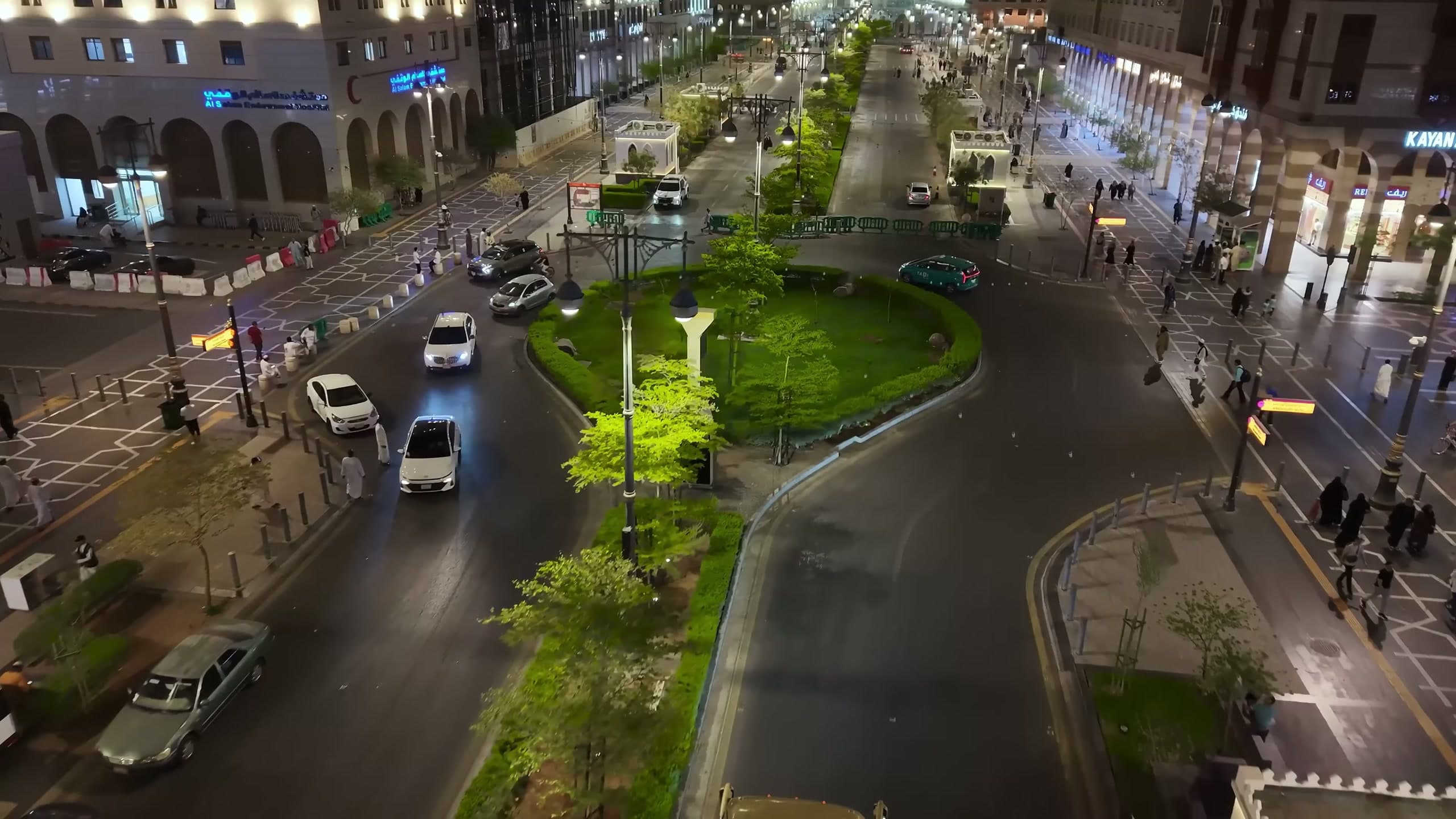 Night view of a roundabout junction in the Central Area with lighting columns around the central island