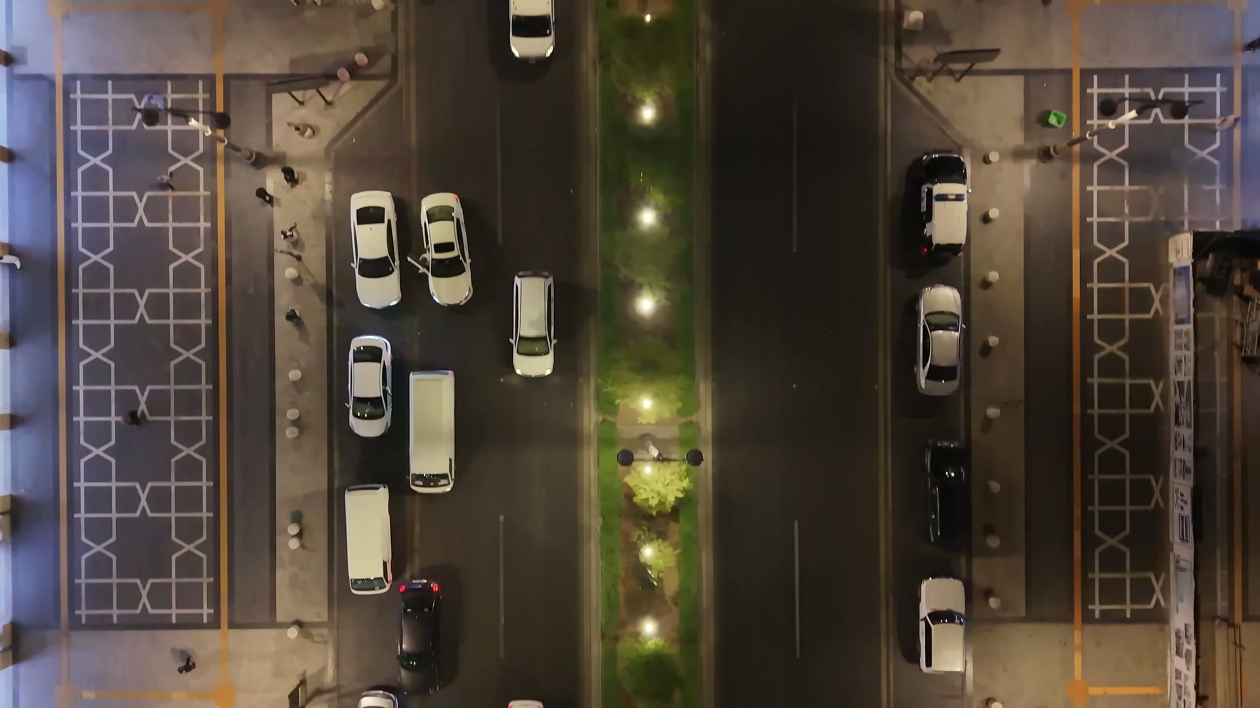 Top-down aerial view of the Central Area corridor showing the sequence of light pools along the central median