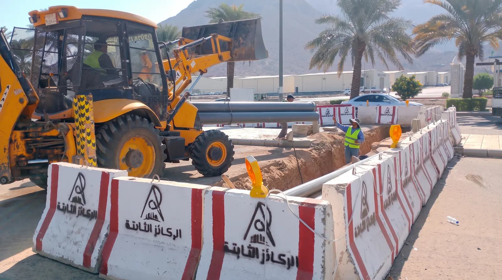Loader and pipes inside a protected installation zone