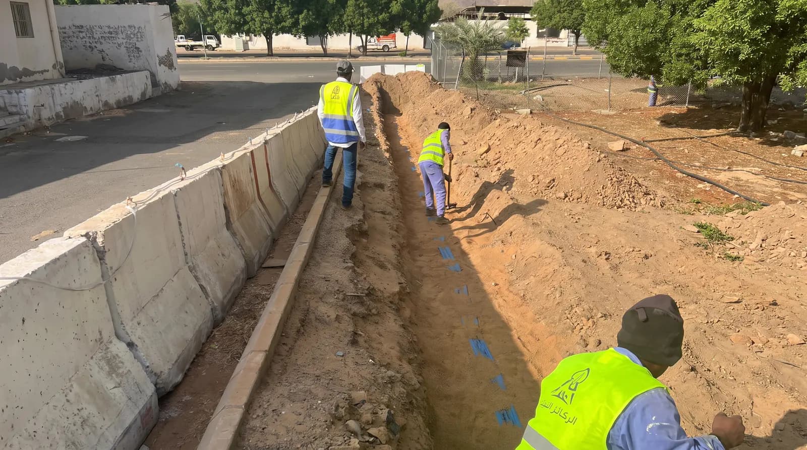Service trench beside the road on the irrigation networks and wells project