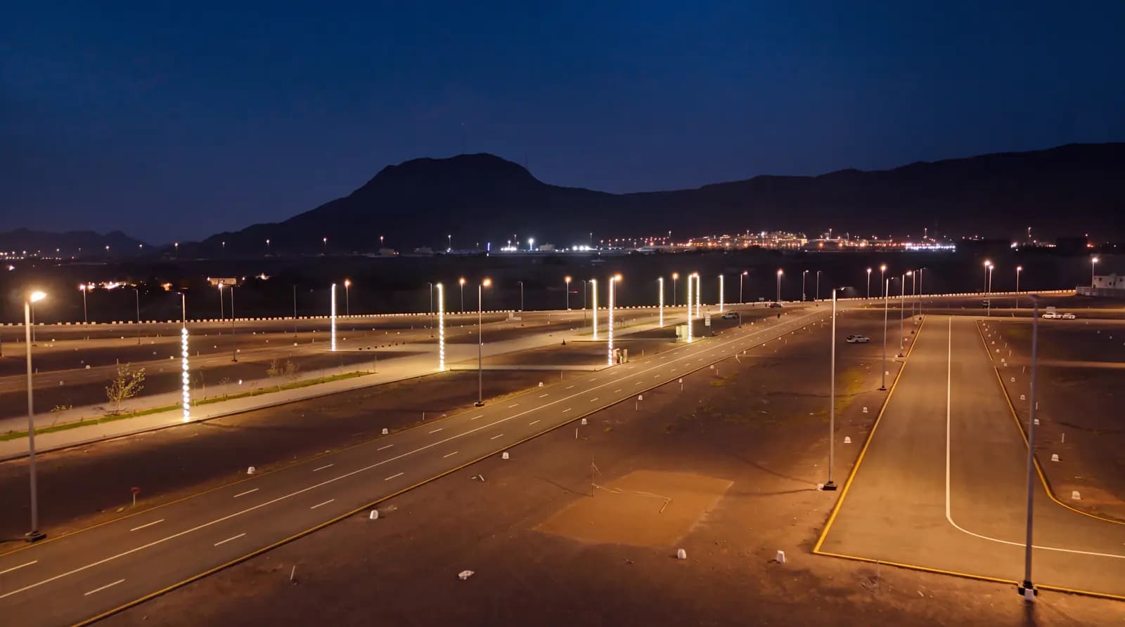 Internal roads illuminated at night within one of the delivered private developments